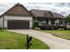Attractive single-story home with an attached garage, manicured lawn and long driveway at 30 Imperial Dr, Clayton, NC 27527
