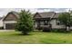 Well-kept one-story home featuring a lovely front lawn and inviting front porch with black railings at 30 Imperial Dr, Clayton, NC 27527