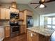 Beautiful kitchen featuring granite countertops, stainless steel appliances, light wood cabinets, and an island at 30 Imperial Dr, Clayton, NC 27527