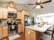 Bright kitchen equipped with stainless appliances, granite countertops, and ample cabinet space at 30 Imperial Dr, Clayton, NC 27527
