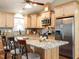 Modern kitchen featuring granite countertops, stainless steel appliances, and a breakfast bar at 30 Imperial Dr, Clayton, NC 27527