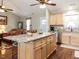 Open kitchen featuring a granite island, stainless steel appliances, and hardwood floors at 30 Imperial Dr, Clayton, NC 27527