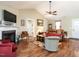 Spacious living room featuring wood floors, fireplace and access to dining and living area at 30 Imperial Dr, Clayton, NC 27527