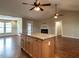 Open concept living space with hardwood floors, a fireplace, and access to sunroom and dining area at 30 Imperial Dr, Clayton, NC 27527