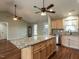 Bright, open kitchen overlooking the dining and living spaces with hardwood floors and natural light at 30 Imperial Dr, Clayton, NC 27527