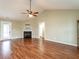 Spacious living room featuring wood floors, a ceiling fan and a marble fireplace at 30 Imperial Dr, Clayton, NC 27527