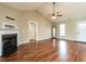 Open concept living room with vaulted ceilings, hardwood floors, and a fireplace at 30 Imperial Dr, Clayton, NC 27527