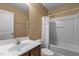 A standard bathroom with a shower-tub combo and a vanity with dark wood cabinets at 3003 Weston Green Loop, Cary, NC 27513