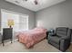 This inviting bedroom has a ceiling fan, carpet, and a window with natural light at 3003 Weston Green Loop, Cary, NC 27513