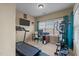 Home gym with treadmill, elliptical machine, and a desk with computer at 3003 Weston Green Loop, Cary, NC 27513
