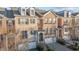 Charming brick townhome featuring detailed architectural elements and manicured landscaping in an inviting neighborhood at 3003 Weston Green Loop, Cary, NC 27513