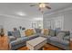 Cozy living room with large sectional sofa, fan and access to dining area at 3003 Weston Green Loop, Cary, NC 27513
