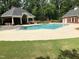 Community pool featuring clear blue water and a covered pavilion for residents to enjoy at 3003 Weston Green Loop, Cary, NC 27513