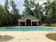 Community pool area featuring a covered pavilion, lounge chairs, and well-maintained landscaping at 3003 Weston Green Loop, Cary, NC 27513