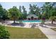 Community pool with lounge chairs and covered pavilion for resident relaxation at 3003 Weston Green Loop, Cary, NC 27513