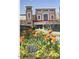 Retail area at Park West Village with B&B Theatres, surrounded by colorful spring flowers at 3003 Weston Green Loop, Cary, NC 27513