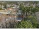 A stunning aerial view shows a house situated in a lush neighborhood with tree-lined streets and well-kept homes at 305 November St, Garner, NC 27529