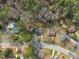Scenic aerial view of a residential neighborhood with lush green trees and well-maintained houses at 305 November St, Garner, NC 27529