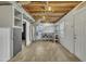 Spacious basement with unfinished ceiling, modern flooring and large storage cabinets at 305 November St, Garner, NC 27529