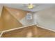 Bedroom features include ceiling fan, hardwood floors, geometric wall design, and natural light at 305 November St, Garner, NC 27529