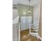 Entryway with wooden stairs and a white front door that provides access to the home at 305 November St, Garner, NC 27529