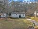 Charming home with a well-maintained front yard, freshly painted exterior, and a neatly paved driveway at 305 November St, Garner, NC 27529
