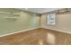 Bright living room with hardwood floors, recessed lighting, and modern floating shelves at 305 November St, Garner, NC 27529