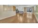 Open-concept living room with hardwood floors, recessed lighting, and seamless transition to the outdoor deck at 305 November St, Garner, NC 27529