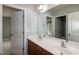 Bathroom vanity featuring double sinks, dark wood cabinets and modern fixtures at 309 Mainline Sta, Morrisville, NC 27560