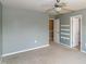 A simple bedroom with a ceiling fan and access to a walk-in closet at 309 Mainline Sta, Morrisville, NC 27560