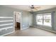 Airy bedroom with a ceiling fan, and a view to the bright bathroom at 309 Mainline Sta, Morrisville, NC 27560