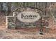 Stone entrance sign that reads 'Keystone Crossing' and surrounded by a wooded area at 309 Mainline Sta, Morrisville, NC 27560
