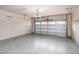 A two-car garage with garage door and a smooth concrete floor at 309 Mainline Sta, Morrisville, NC 27560