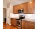 A modern kitchen featuring stainless steel appliances, granite counters and white subway tile at 309 Mainline Sta, Morrisville, NC 27560