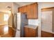 Shows a well-organized kitchen, featuring wooden cabinets and stainless-steel appliances at 309 Mainline Sta, Morrisville, NC 27560