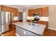 Shows a kitchen with stainless steel appliances and a granite countertop island at 309 Mainline Sta, Morrisville, NC 27560