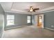 Spacious main bedroom with trey ceiling, fan, two windows, and an ensuite bathroom at 309 Mainline Sta, Morrisville, NC 27560