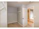 Open door reveals a spacious walk-in closet and the bright, tiled bathroom beyond at 309 Mainline Sta, Morrisville, NC 27560