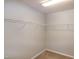 A spacious walk-in closet offers ample storage with shelving installed along the walls at 309 Mainline Sta, Morrisville, NC 27560