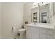 Bright bathroom with white vanity, mirror, and ample lighting at 318 Mccauley St # 2, Chapel Hill, NC 27516
