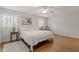 Bright bedroom with hardwood floors, ceiling fan, and two windows at 318 Mccauley St # 2, Chapel Hill, NC 27516