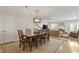 Spacious dining room with elegant lighting fixtures seamlessly flows into an inviting living area at 318 Mccauley St # 2, Chapel Hill, NC 27516