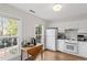 Bright kitchen nook featuring a cozy breakfast table, natural light, and modern appliances at 318 Mccauley St # 2, Chapel Hill, NC 27516
