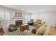 Spacious living room showcasing a cozy fireplace, large TV, and comfortable seating arrangement at 318 Mccauley St # 2, Chapel Hill, NC 27516