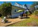 Outdoor patio with seating, grill, and backyard view, complete with green umbrella at 319 W Margaret Ln, Hillsborough, NC 27278