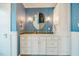 Updated bathroom features marble countertops and sleek white cabinets at 319 W Margaret Ln, Hillsborough, NC 27278