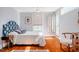 Bright bedroom with hardwood floors, ceiling fan, and private entry at 319 W Margaret Ln, Hillsborough, NC 27278
