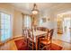 Cozy dining room featuring a chandelier, vintage accents, and wooden table with chairs at 319 W Margaret Ln, Hillsborough, NC 27278