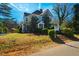 Charming two-story home with screened in porch on a lush lawn at 319 W Margaret Ln, Hillsborough, NC 27278