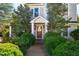 Inviting two-story home with lush landscaping leading to the front door at 319 W Margaret Ln, Hillsborough, NC 27278